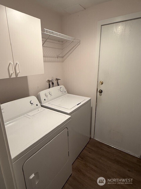 1555 Union Ave NE Unit 56, Renton, WA 98059 - laundry area with washing machine and dryer, cabinet space, and dark wood-style floors