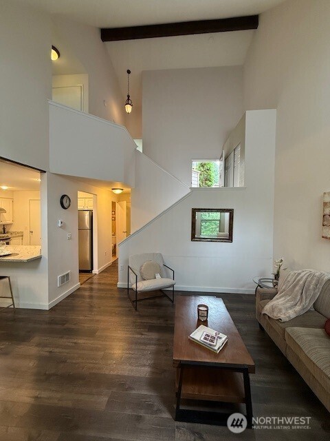 1555 Union Ave NE Unit 56, Renton, WA 98059 - living room with high vaulted ceiling, wood finished floors, beam ceiling, and stairs