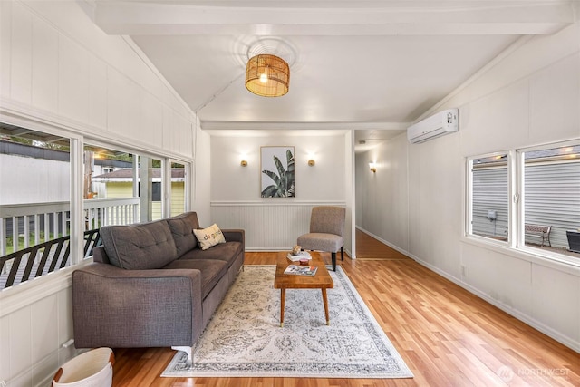 316 W Lake Samish Dr Unit 21, Bellingham, WA 98229 - living area featuring a wall mounted air conditioner, light wood-type flooring, and a decorative wall