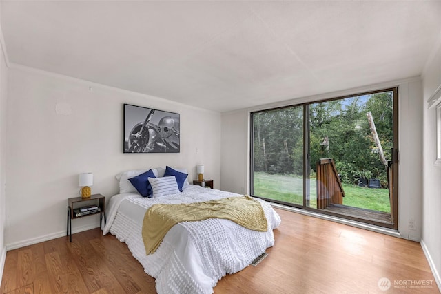 316 W Lake Samish Dr Unit 21, Bellingham, WA 98229 - bedroom featuring access to exterior and wood finished floors