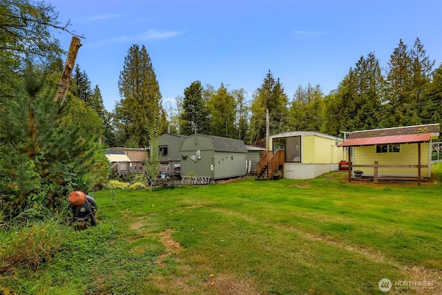 316 W Lake Samish Dr Unit 21, Bellingham, WA 98229 - view of grassy yard featuring a shed