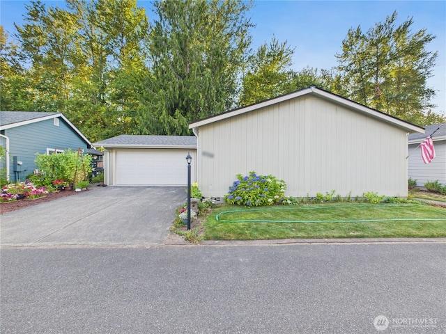 6704 243rd Ave E Unit 96, Buckley, WA 98321 - view of home's exterior featuring a garage and a lawn