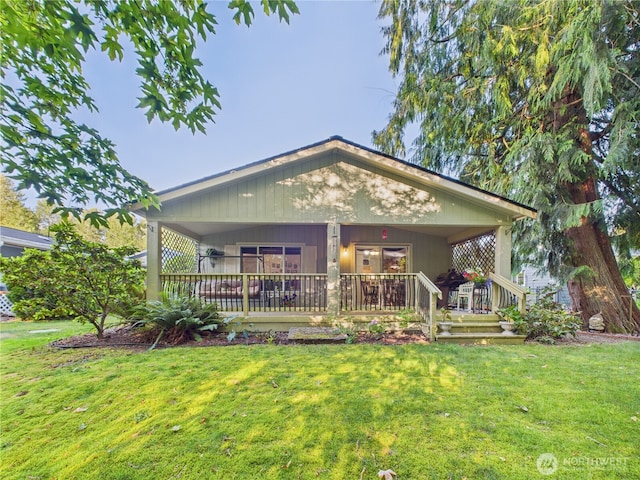 6704 243rd Ave E Unit 96, Buckley, WA 98321 - rear view of house with a lawn and covered porch