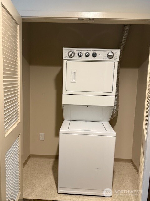 1515 Dock St Unit 210, Tacoma, WA 98402 - laundry room with estacked washer and dryer and baseboards