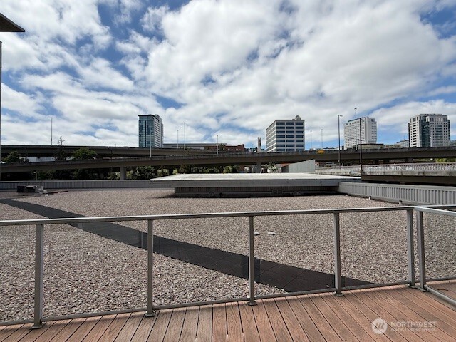 1515 Dock St Unit 210, Tacoma, WA 98402 - wooden deck featuring a city view