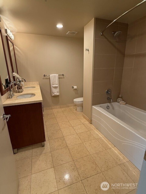1515 Dock St Unit 210, Tacoma, WA 98402 - full bathroom featuring shower / washtub combination, tile patterned flooring, double vanity, and recessed lighting