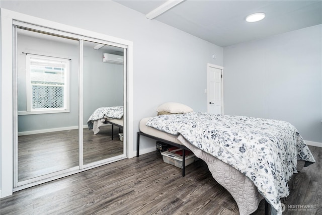403 S 2nd St, Mccleary, WA 98557 - bedroom with a wall mounted air conditioner, wood finished floors, and a closet