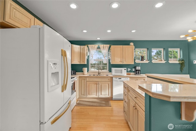 11 Condra Rd, Copalis Beach, WA 98535 - kitchen with white appliances, light countertops, light wood-type flooring, recessed lighting, and light brown cabinets
