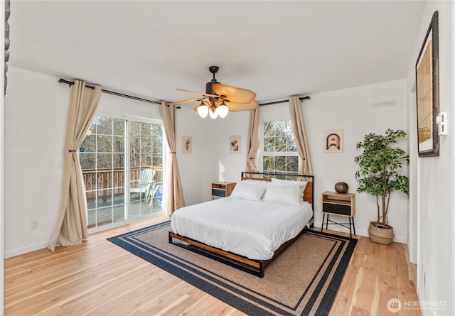 11 Condra Rd, Copalis Beach, WA 98535 - bedroom featuring access to outside, multiple windows, wood finished floors, and ceiling fan