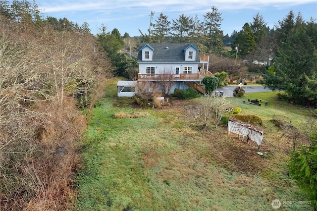 11 Condra Rd, Copalis Beach, WA 98535 - back of house featuring stairs, a lawn, and a wooden deck