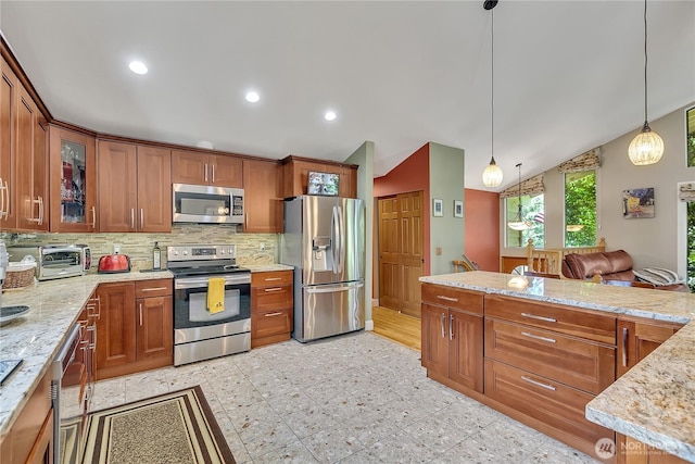 5103 S 302nd Pl, Auburn, WA 98001 - kitchen with appliances with stainless steel finishes, brown cabinets, backsplash, glass insert cabinets, and decorative light fixtures