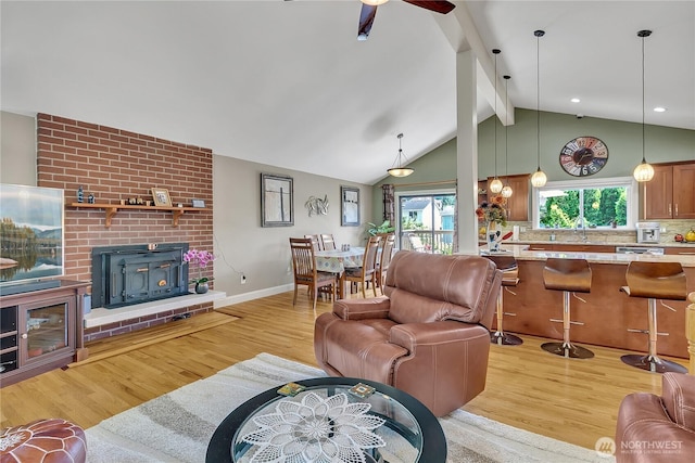 5103 S 302nd Pl, Auburn, WA 98001 - living area featuring a wood stove, light wood-type flooring, and ceiling fan