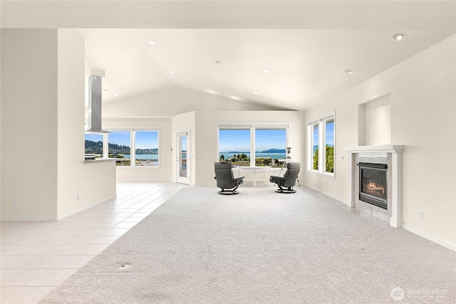 2011 Eldridge Ave, Bellingham, WA 98225 - unfurnished living room featuring lofted ceiling, a premium fireplace, tile patterned floors, carpet, and recessed lighting