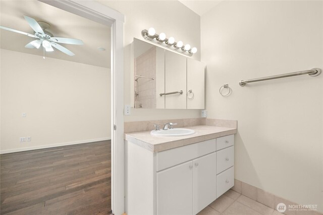 2011 Eldridge Ave, Bellingham, WA 98225 - bathroom featuring vanity, a ceiling fan, a shower, and wood finished floors
