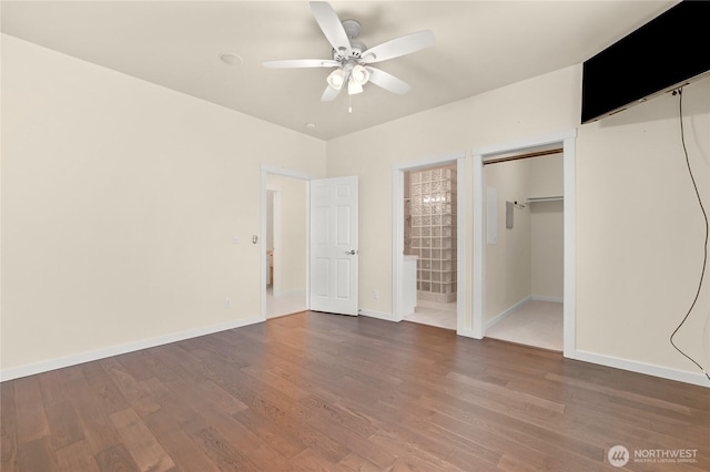 2011 Eldridge Ave, Bellingham, WA 98225 - unfurnished bedroom featuring wood finished floors, connected bathroom, and ceiling fan
