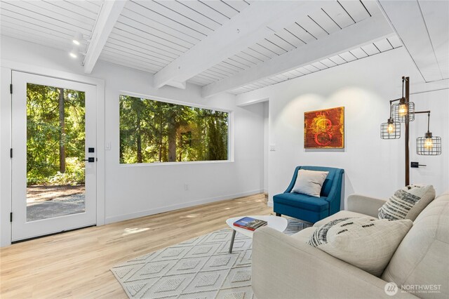 14517 SE 41st Ln, Bellevue, WA 98006 - living room featuring healthy amount of natural light, light wood-type flooring, and a wood ceiling with exposed beams