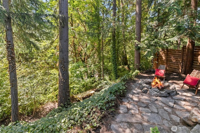 14517 SE 41st Ln, Bellevue, WA 98006 - view of patio / terrace with an outdoor fire pit and a view of trees