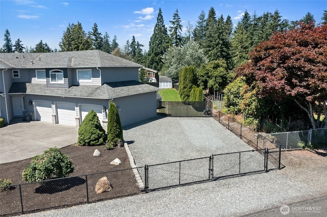 4024RD E Caldwell, Edgewood, WA 98372 - view of front of home with driveway, a gate, a garage, and roof with shingles