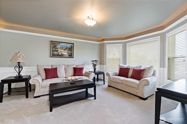 4024RD E Caldwell, Edgewood, WA 98372 - living room with a tray ceiling, a wainscoted wall, light colored carpet, and ornamental molding