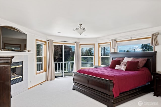 4024RD E Caldwell, Edgewood, WA 98372 - carpeted bedroom with access to exterior and a fireplace