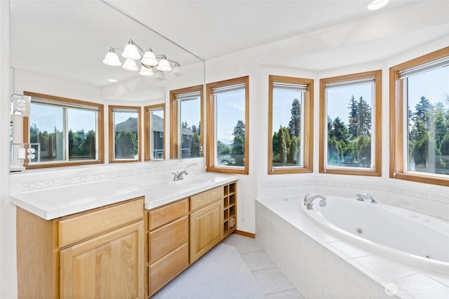 4024RD E Caldwell, Edgewood, WA 98372 - bathroom featuring a tub with jets, vanity, and tile patterned floors