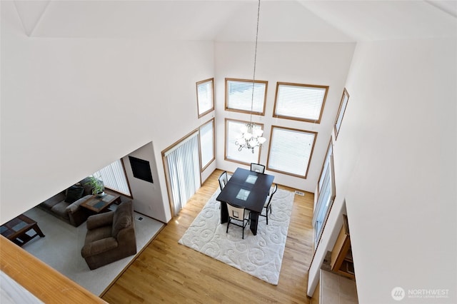 4024RD E Caldwell, Edgewood, WA 98372 - living room with a chandelier, a high ceiling, and wood finished floors