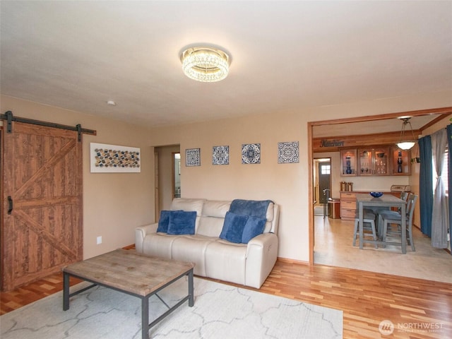 136 W 13th St, Port Angeles, WA 98362 - living room with light wood finished floors and a barn door