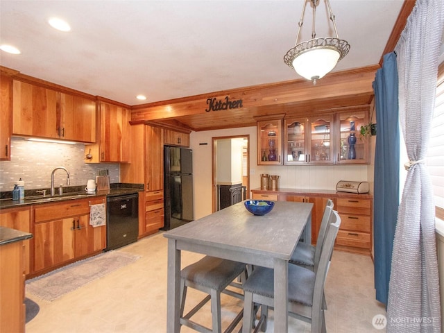136 W 13th St, Port Angeles, WA 98362 - kitchen featuring black appliances, brown cabinets, dark countertops, tasteful backsplash, and recessed lighting