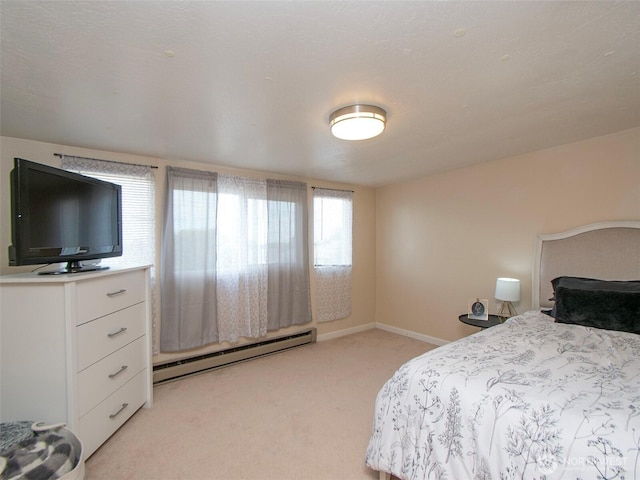 136 W 13th St, Port Angeles, WA 98362 - bedroom featuring a baseboard radiator and light carpet