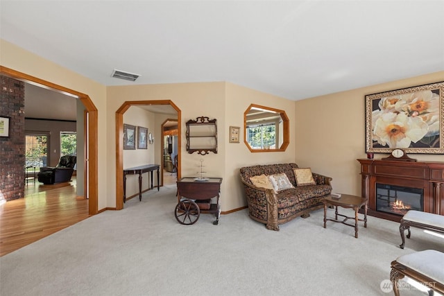 405 S Waugh Rd, Mount Vernon, WA 98274 - carpeted living room with a glass covered fireplace and arched walkways