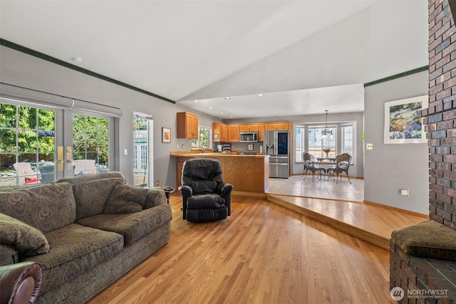 405 S Waugh Rd, Mount Vernon, WA 98274 - living room with light wood-style floors, high vaulted ceiling, and french doors