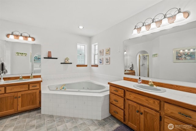 405 S Waugh Rd, Mount Vernon, WA 98274 - bathroom with a jetted tub, two vanities, tile patterned flooring, and a shower stall