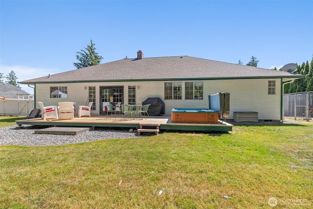 405 S Waugh Rd, Mount Vernon, WA 98274 - rear view of house featuring a hot tub, a deck, french doors, and a chimney