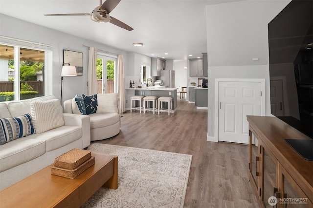 23619 SE 245th St, Maple Valley, WA 98038 - living room featuring a ceiling fan, wood finished floors, and recessed lighting