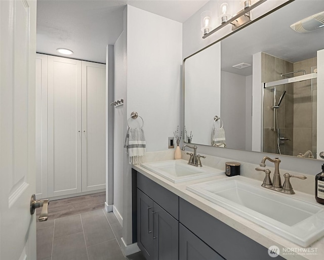 23619 SE 245th St, Maple Valley, WA 98038 - full bath featuring tile patterned flooring, double vanity, and a shower stall
