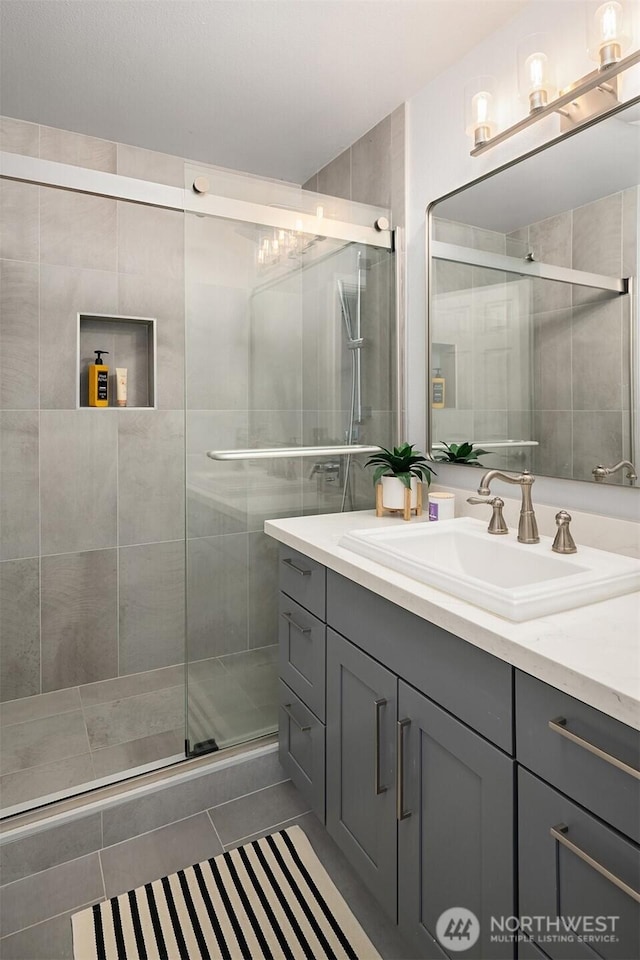 23619 SE 245th St, Maple Valley, WA 98038 - full bath with vanity, a stall shower, and tile patterned floors