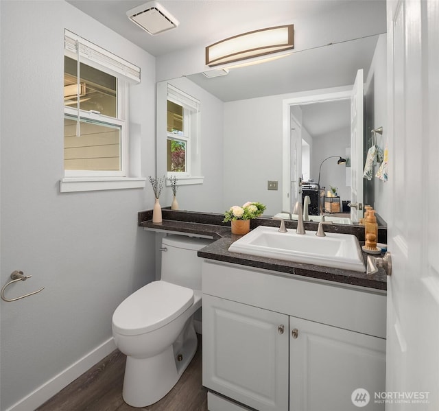 23619 SE 245th St, Maple Valley, WA 98038 - half bathroom featuring vanity and wood finished floors