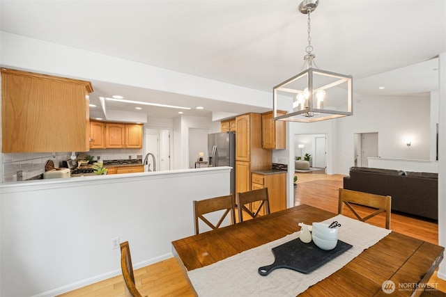 3204 30th St, Bellingham, WA 98225 - dining space with light wood-style floors, a chandelier, and recessed lighting