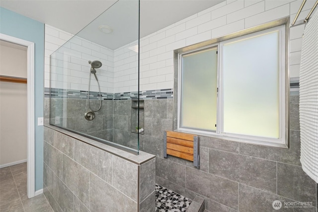 3204 30th St, Bellingham, WA 98225 - bathroom featuring walk in shower, a walk in closet, and tile patterned flooring