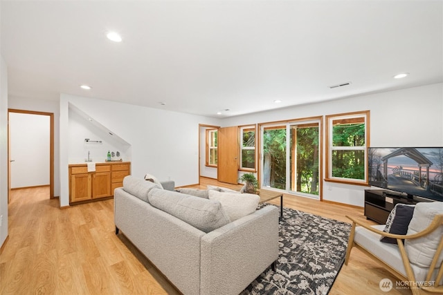 3204 30th St, Bellingham, WA 98225 - living room with light wood finished floors, recessed lighting, and bar area