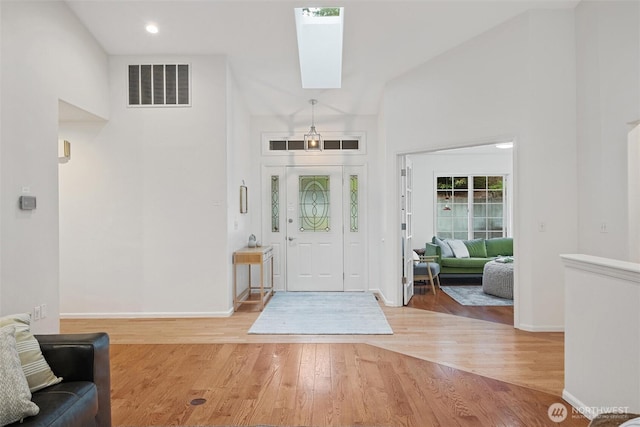 3204 30th St, Bellingham, WA 98225 - foyer with a skylight, light wood-style floors, and a high ceiling
