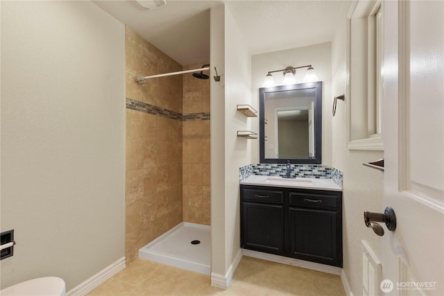 7511 Kittiwake Dr SE, Olympia, WA 98513 - bathroom with a tile shower, vanity, decorative backsplash, and tile patterned floors