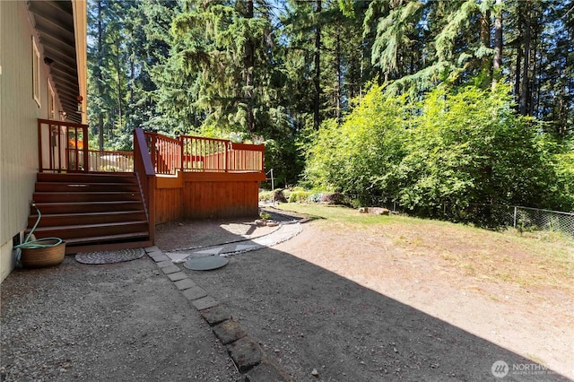 7511 Kittiwake Dr SE, Olympia, WA 98513 - view of yard featuring stairs and a wooden deck
