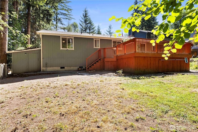 7511 Kittiwake Dr SE, Olympia, WA 98513 - rear view of property with crawl space, a wooden deck, stairs, and a lawn