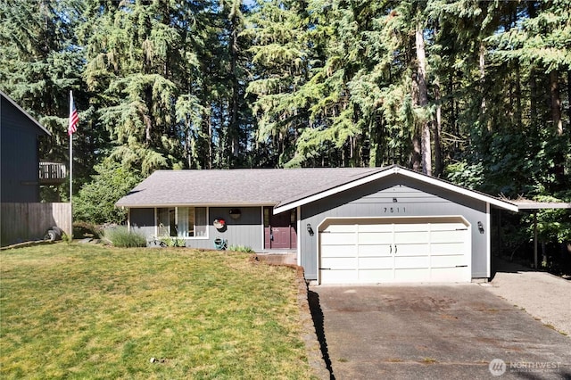 7511 Kittiwake Dr SE, Olympia, WA 98513 - ranch-style house featuring concrete driveway, a garage, and a front lawn