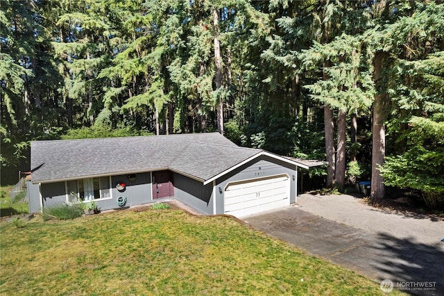 7511 Kittiwake Dr SE, Olympia, WA 98513 - ranch-style house featuring asphalt driveway, an attached garage, a front yard, and a shingled roof