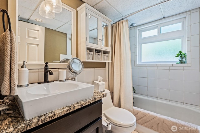 14618 SE 275th Pl, Kent, WA 98042 - bathroom featuring a paneled ceiling, shower / bath combination with curtain, vanity, and tile walls