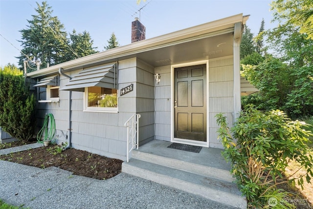 14326 Meridian Ave N, Seattle, WA 98133 - property entrance with a chimney