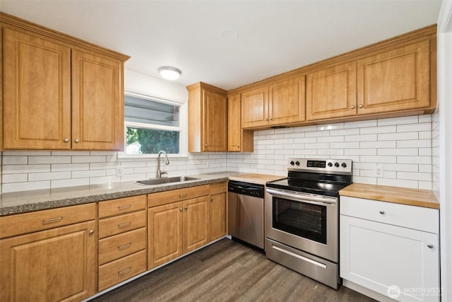 14326 Meridian Ave N, Seattle, WA 98133 - kitchen with appliances with stainless steel finishes, dark wood-style flooring, backsplash, and wooden counters