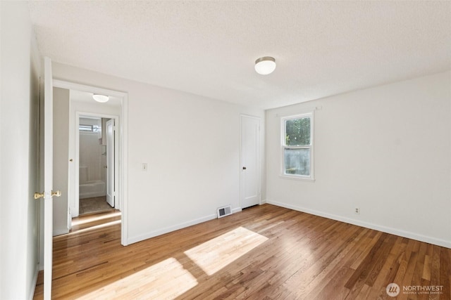 14326 Meridian Ave N, Seattle, WA 98133 - spare room featuring wood finished floors